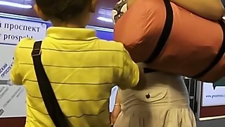 Upskirt look of a stellar platinum-blonde in fishnets