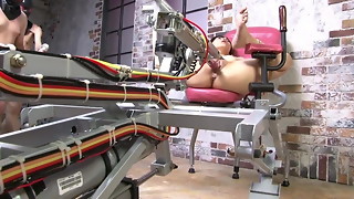 Petite Japanese brunette gets pounded by a fuck machine
