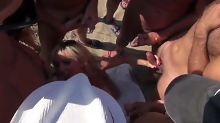 Dozens strangers guys pour blondie on beach Cap d'Agde